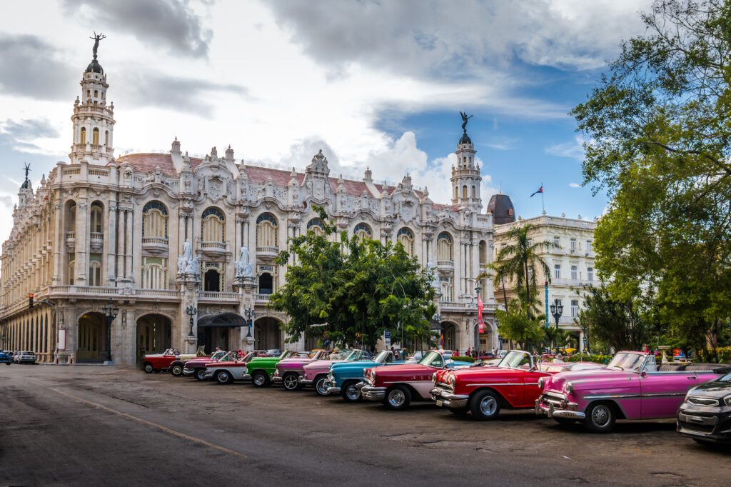 Cuban colorful vintage cars in front of the Gran Teatro - Havana, Cuba