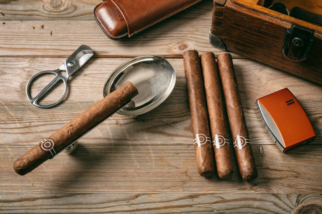 Cuban cigars on wooden background, top view