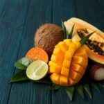 Fresh ripe exotic fruits on wooden background